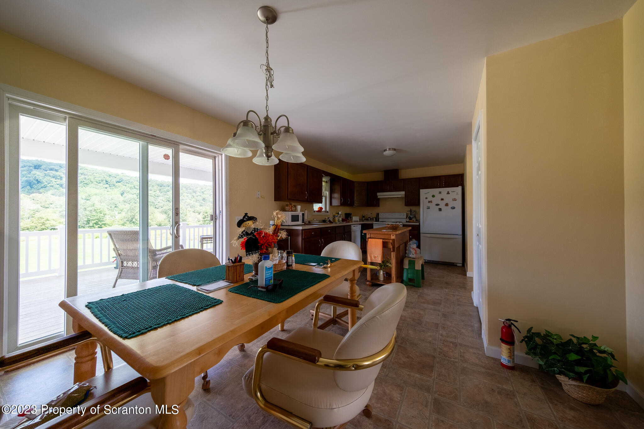 1213 Post Hill Road Falls, PA 18615 - Photo 9 of 21 a room with furniture and a chandelier