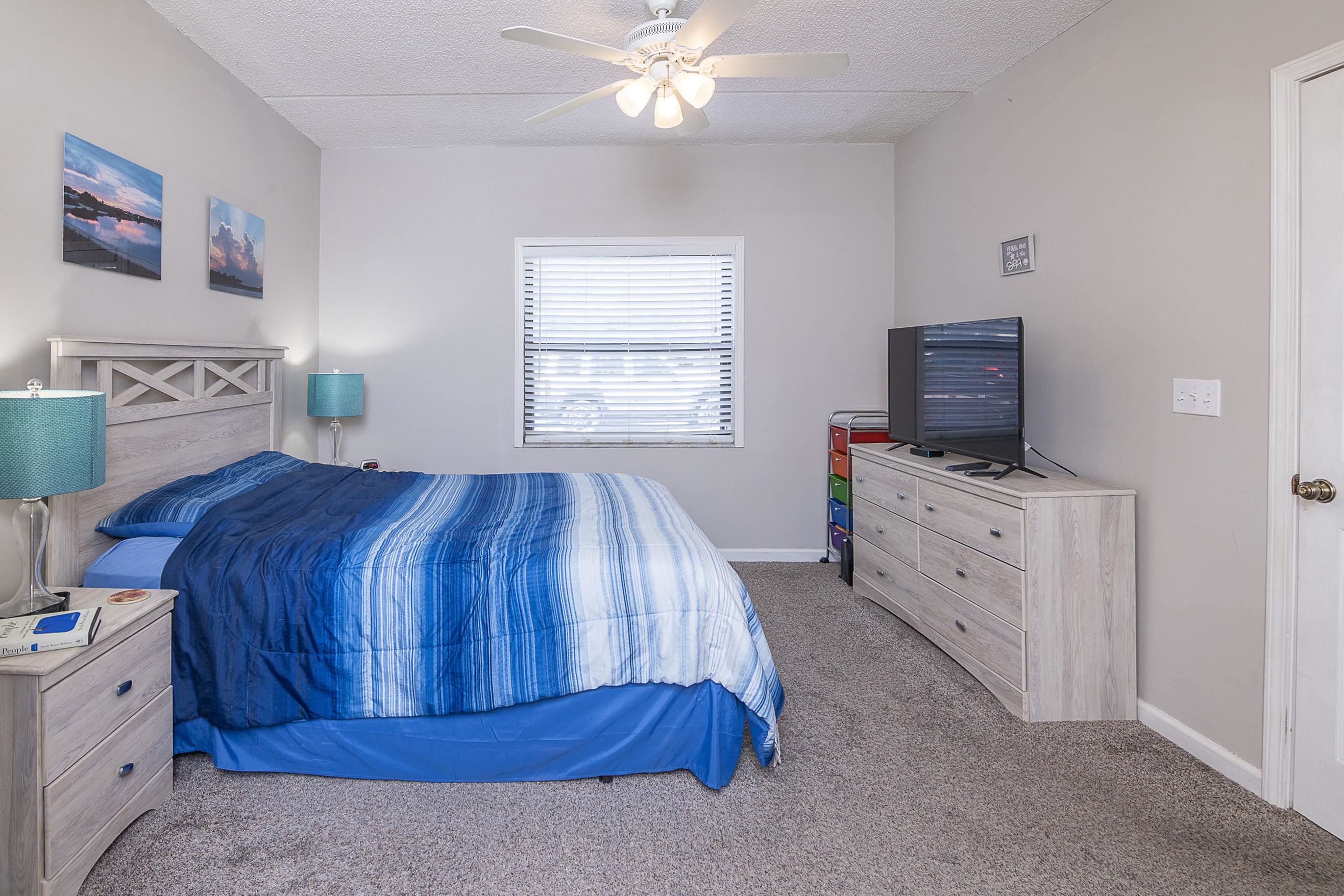 1 Talavera Court St. Augustine, FL 32086 - Photo 14 of 28 a bedroom with a bed and a flat screen tv