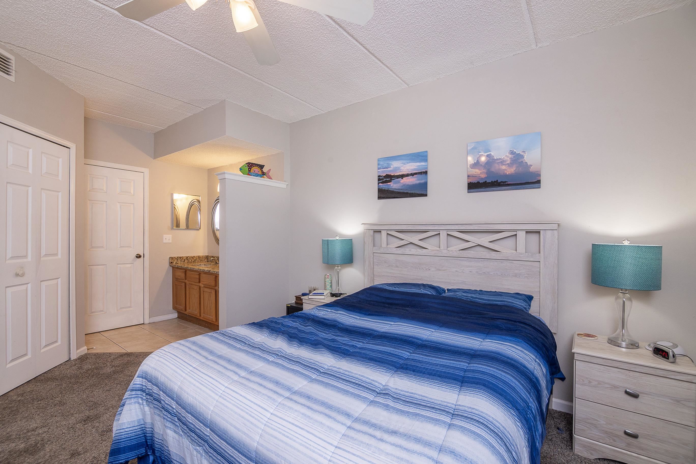 1 Talavera Court St. Augustine, FL 32086 - Photo 17 of 28 a bedroom with a bed and a lamp on table