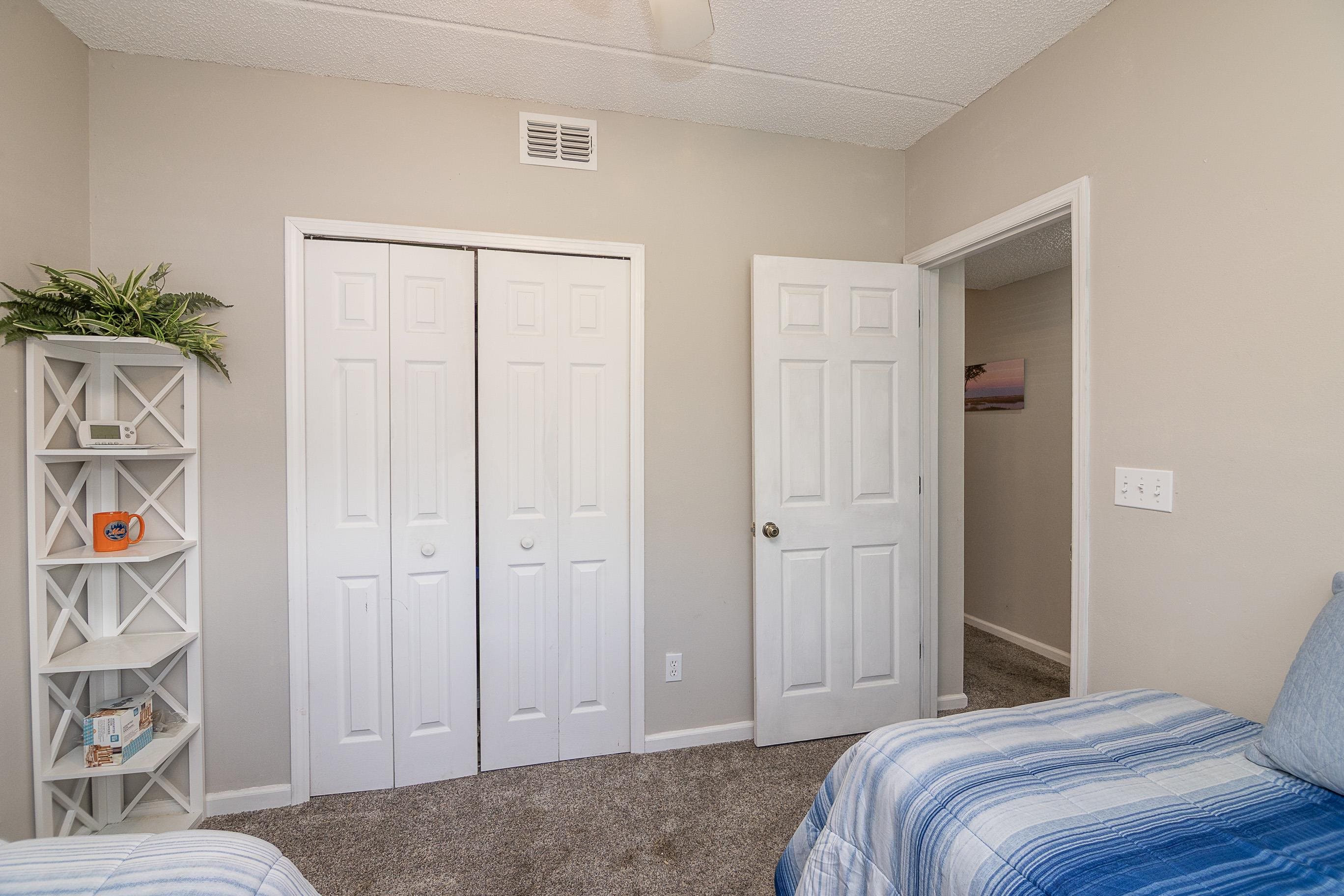 1 Talavera Court St. Augustine, FL 32086 - Photo 20 of 28 a bedroom with a bed and a painting on the wall