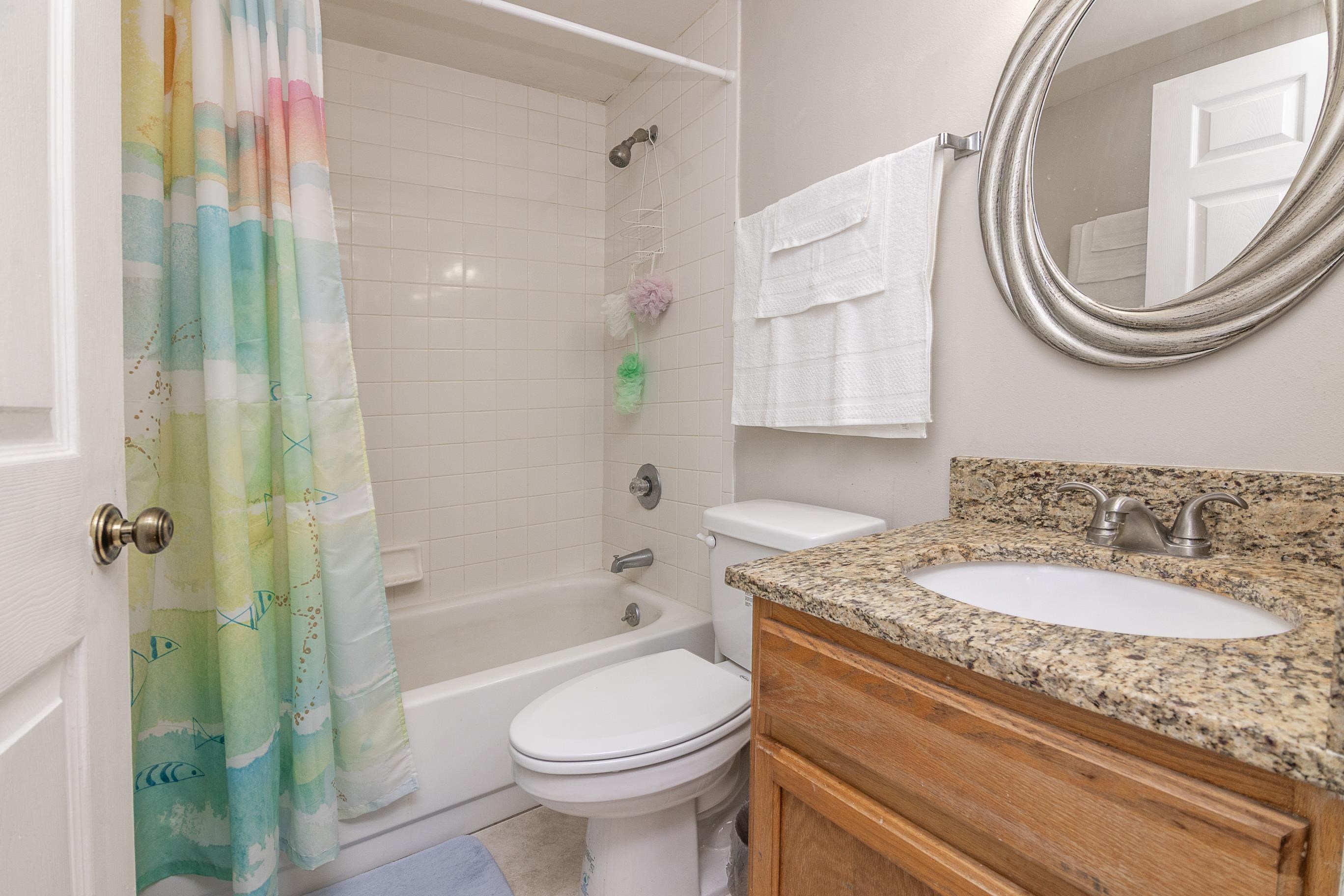 1 Talavera Court St. Augustine, FL 32086 - Photo 21 of 28 a bathroom with a granite countertop toilet sink and mirror