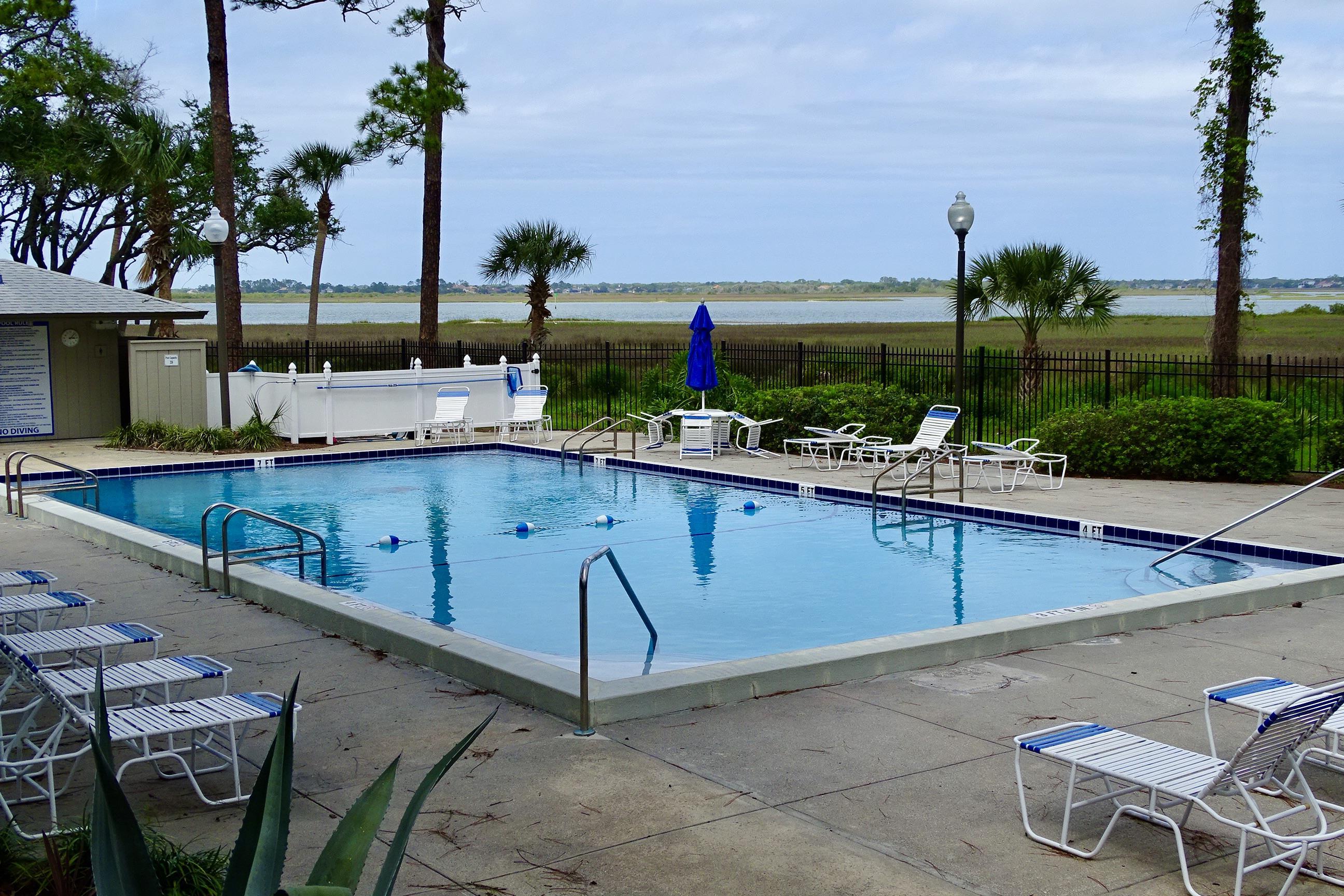 1 Talavera Court St. Augustine, FL 32086 - Photo 24 of 28 a view of a backyard with sitting area