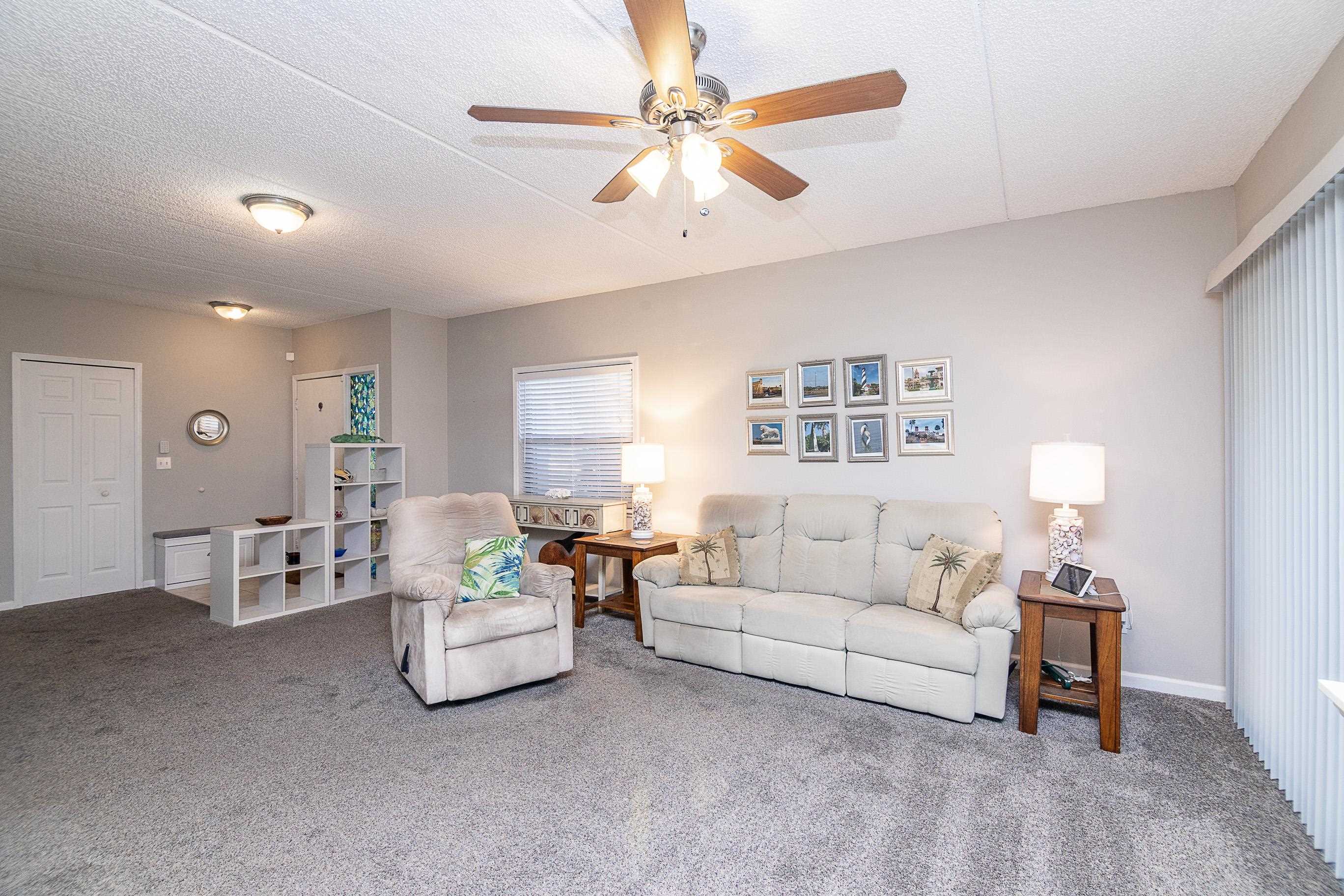 1 Talavera Court St. Augustine, FL 32086 - Photo 7 of 28 a living room with furniture and a large window