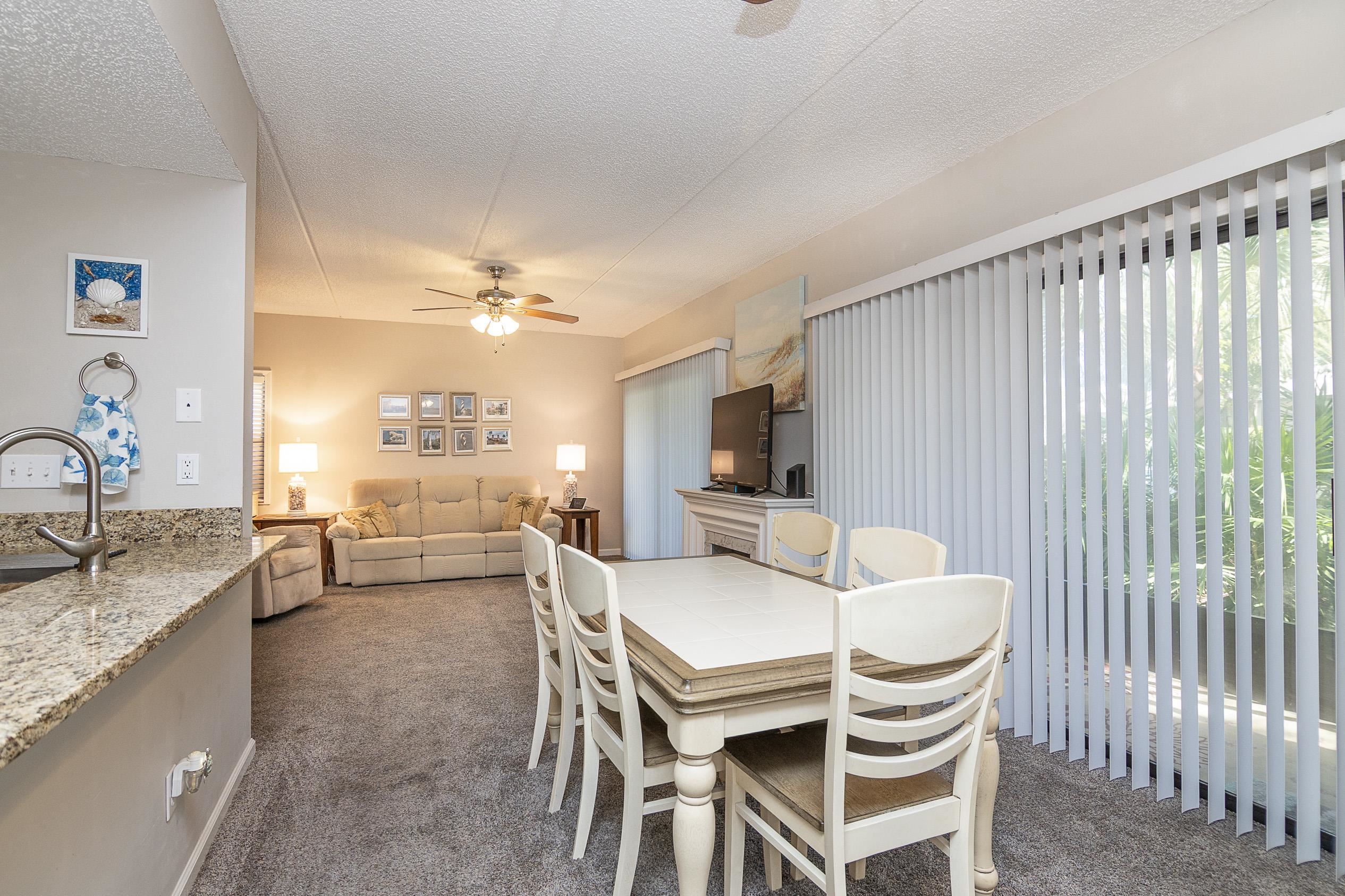 1 Talavera Court St. Augustine, FL 32086 - Photo 8 of 28 a dining room with furniture and a kitchen view