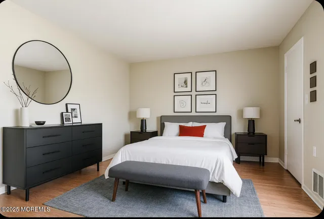 a bedroom with bed and a dresser