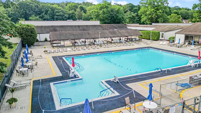 an aerial view of a house with a swimming pool