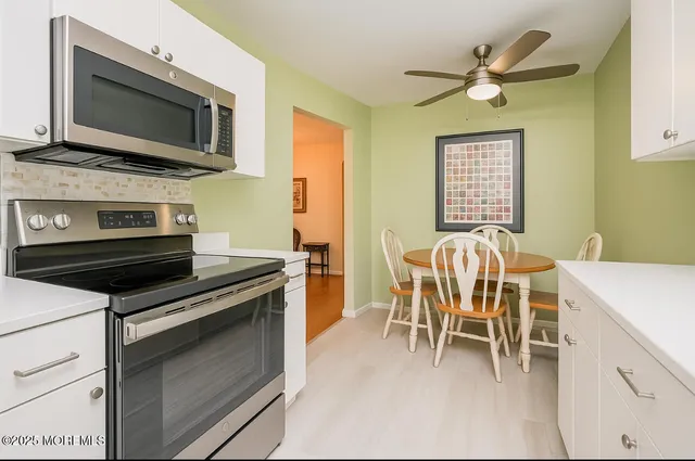 a kitchen with a stove and a microwave