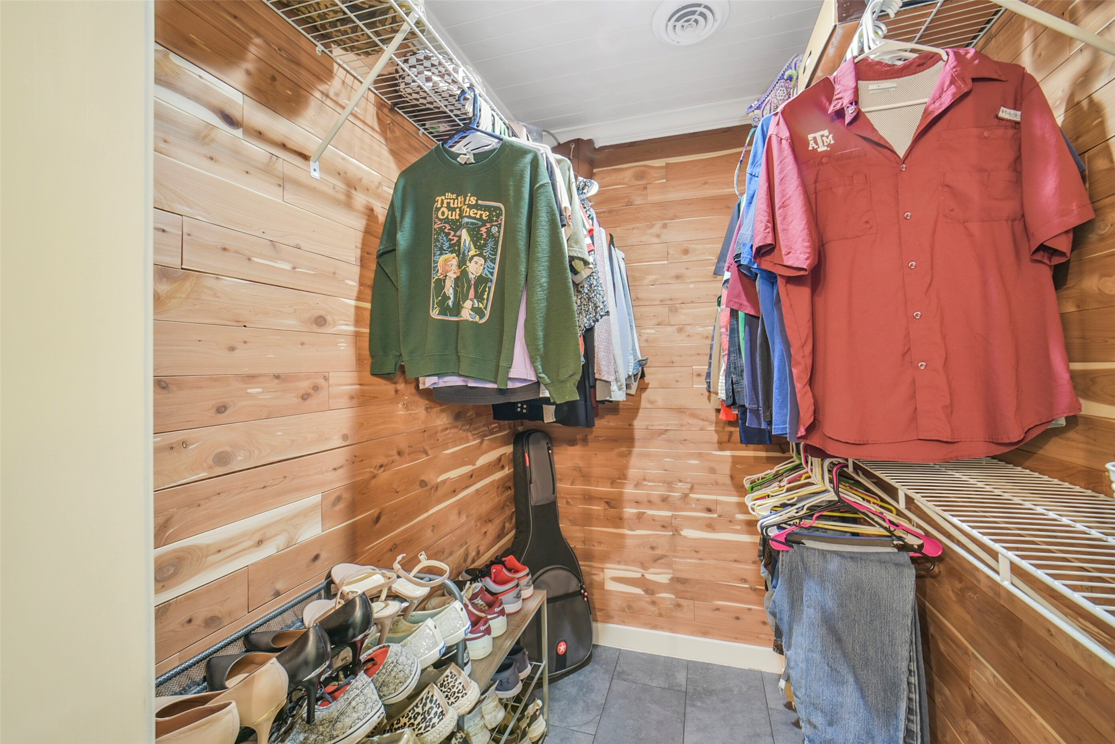 10313 South Williams Road Conroe, TX 77303 - Photo 25 of 48 Primary closet is located off the bathroom and is cedar lined.