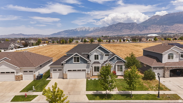 111 East Silver Oak Road Vineyard, UT 84059 - Photo 42 of 50 Contemporary residence with a multi-gabled roofline and light blue siding