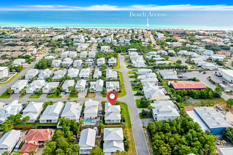 an aerial view of residential houses with outdoor space