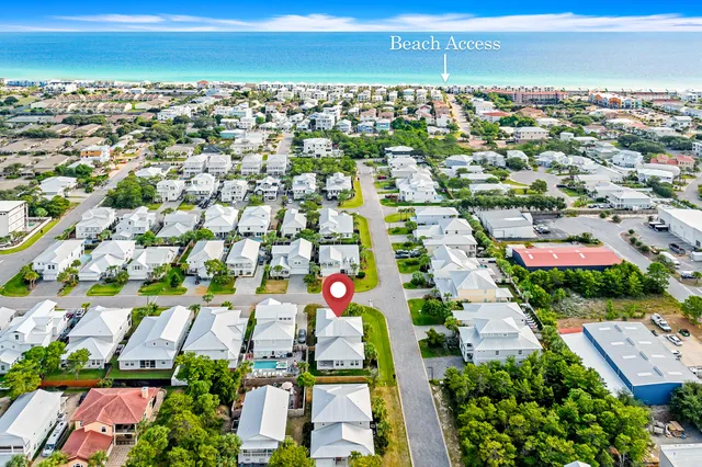 an aerial view of residential houses with outdoor space