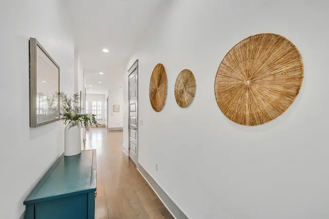 a view of a livingroom with furniture and hardwood floor