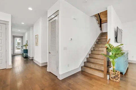 a view of entryway with livingroom and wooden floor