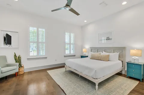 a bedroom with a bed couch and window
