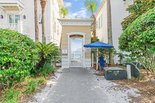 a view of a chair and table in the backyard of the house
