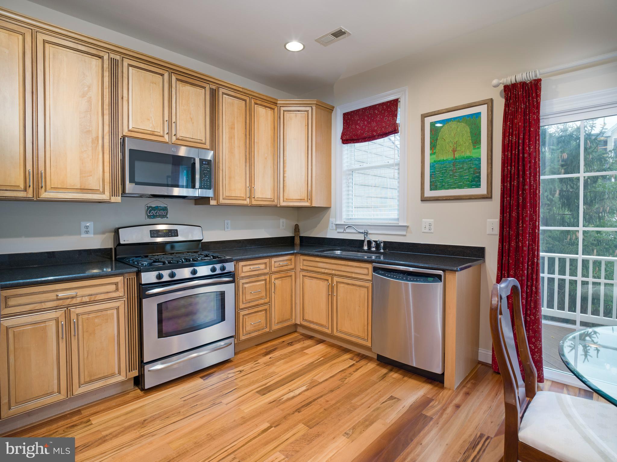 236 West Spring Avenue Ardmore, PA 19003 - Photo 5 of 30 a kitchen with stainless steel appliances granite countertop a stove a sink and a microwave