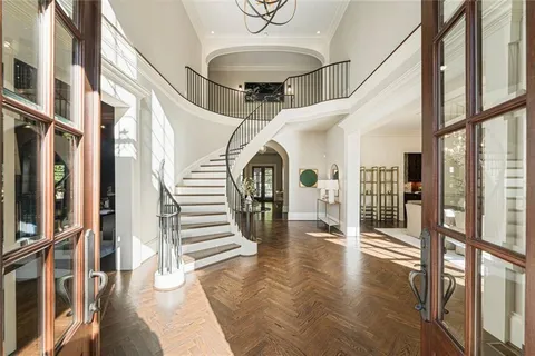 a living room with fireplace furniture and a large window