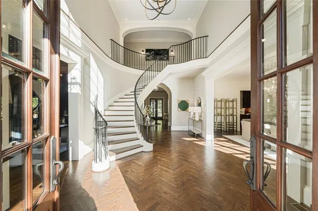 a living room with fireplace furniture and a large window