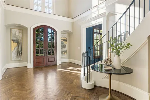 a living room with furniture fireplace and flat screen tv