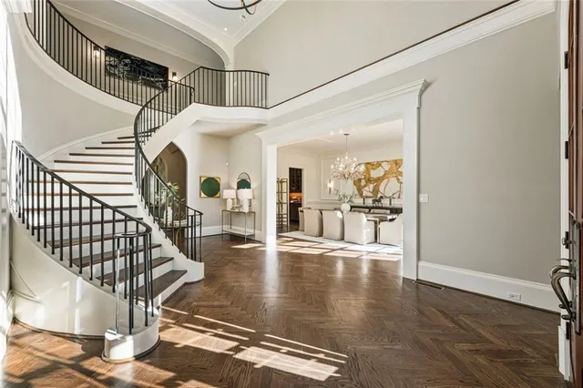 a living room with furniture a table and a fireplace