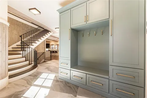 a view of a dining room with furniture and a chandelier