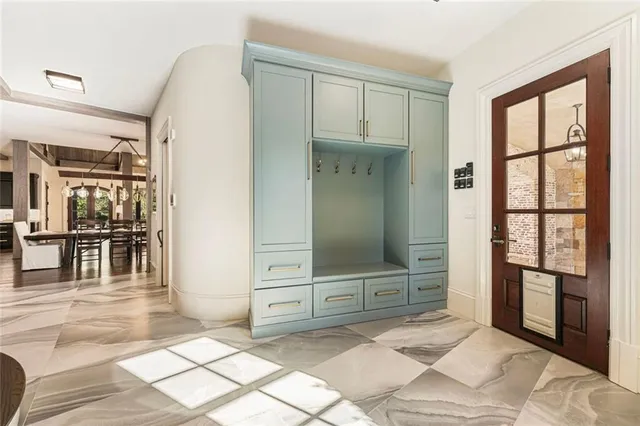 a view of a dining room with furniture wooden floor and a chandelier