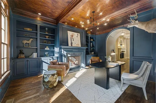 a kitchen with stainless steel appliances granite countertop a lot of counter space and wooden floors