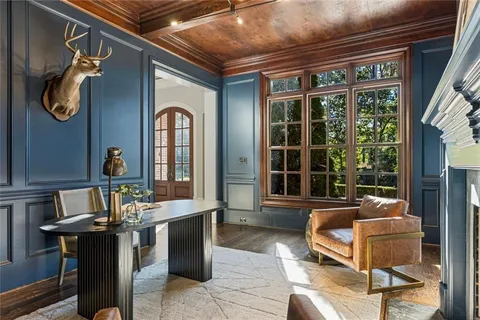 a kitchen with kitchen island granite countertop lots of counter top space and stainless steel appliances
