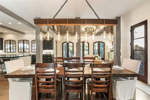 a living room with furniture and windows