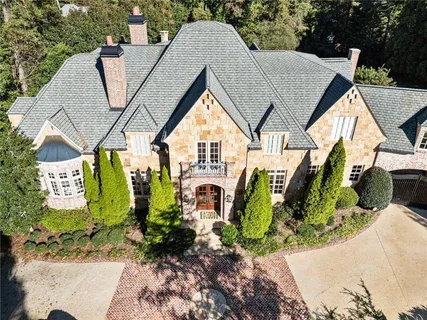 a living room with furniture fireplace and a fireplace