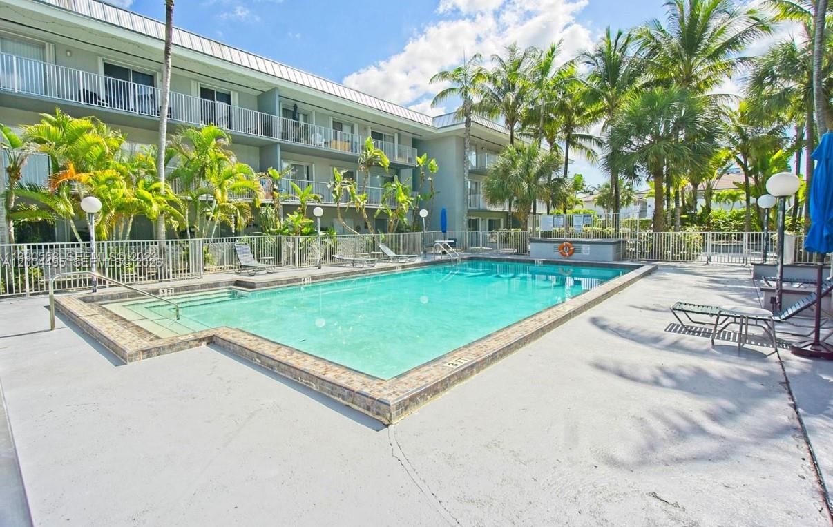 7401 Southwest 82nd Street, Unit 207S Miami, FL 33143 - Photo 12 of 15 a view of a backyard with a garden and plants