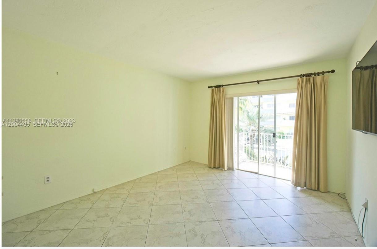 7401 Southwest 82nd Street, Unit 207S Miami, FL 33143 - Photo 7 of 15 a view of an empty room with a window