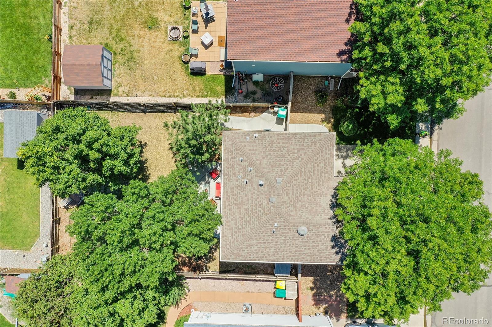 1489 Hummingbird Circle Brighton, CO 80601 - Photo 35 of 46 an aerial view of a house with table and chairs and potted plants