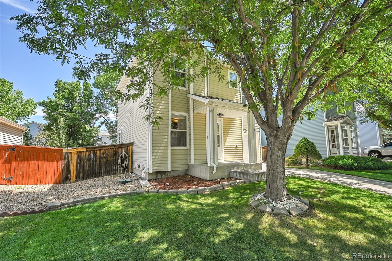 1489 Hummingbird Circle Brighton, CO 80601 - Photo 46 of 46 a view of a house with a yard