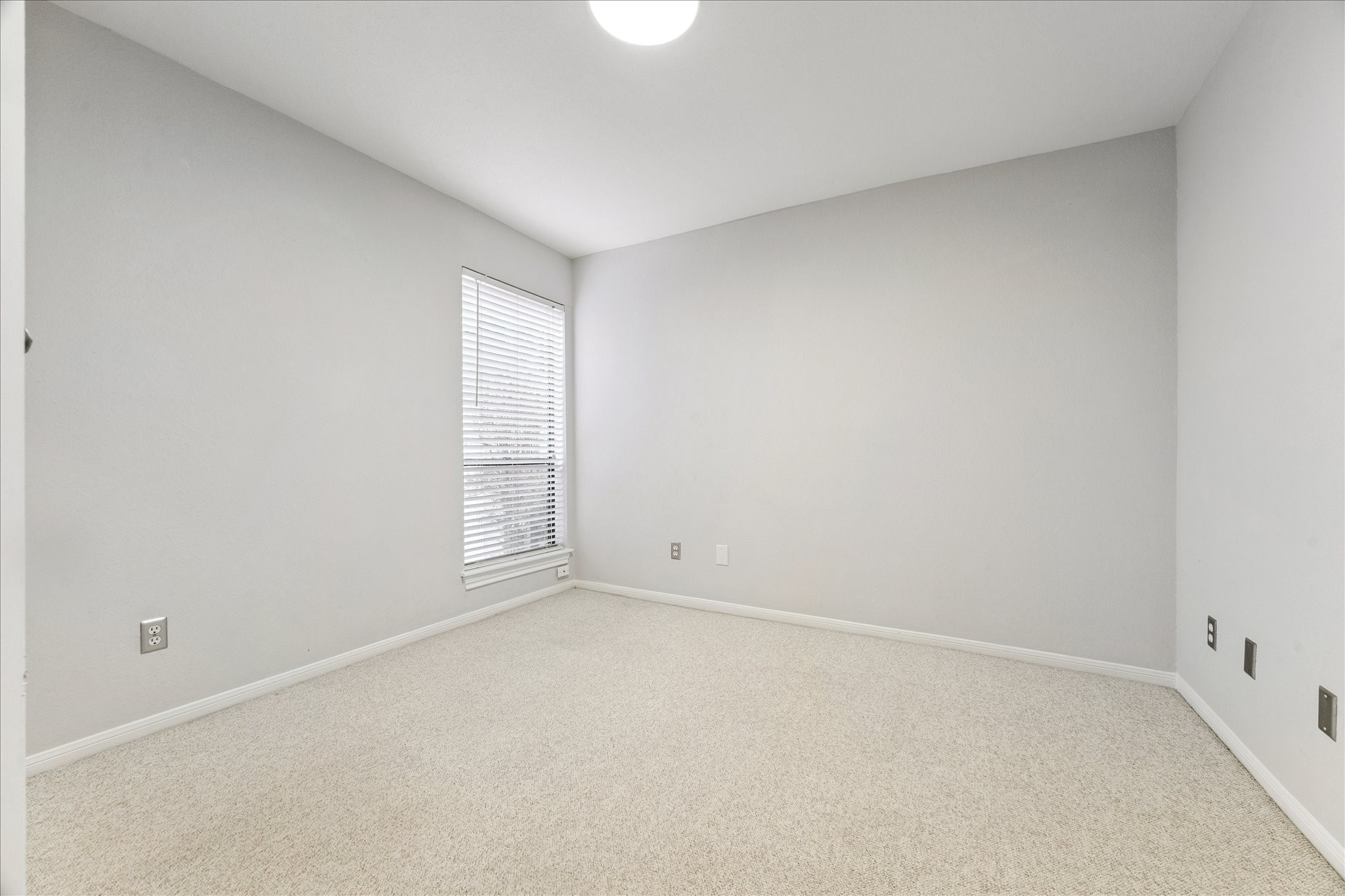 1201 Bering Drive, Unit 100 Houston, TX 77057 - Photo 15 of 20 a view of an empty room with a window