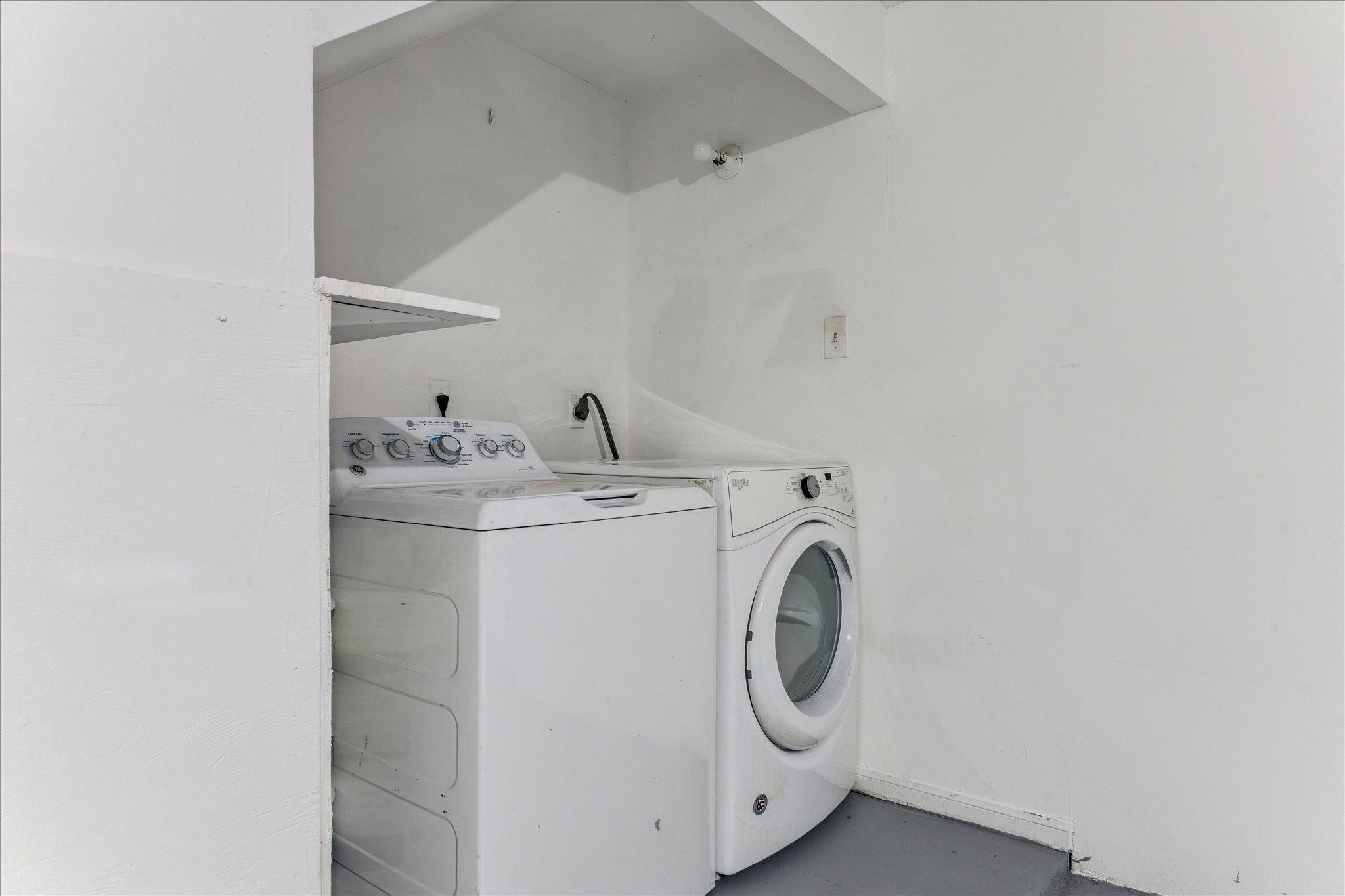 1201 Bering Drive, Unit 100 Houston, TX 77057 - Photo 18 of 20 a utility room with dryer and washer