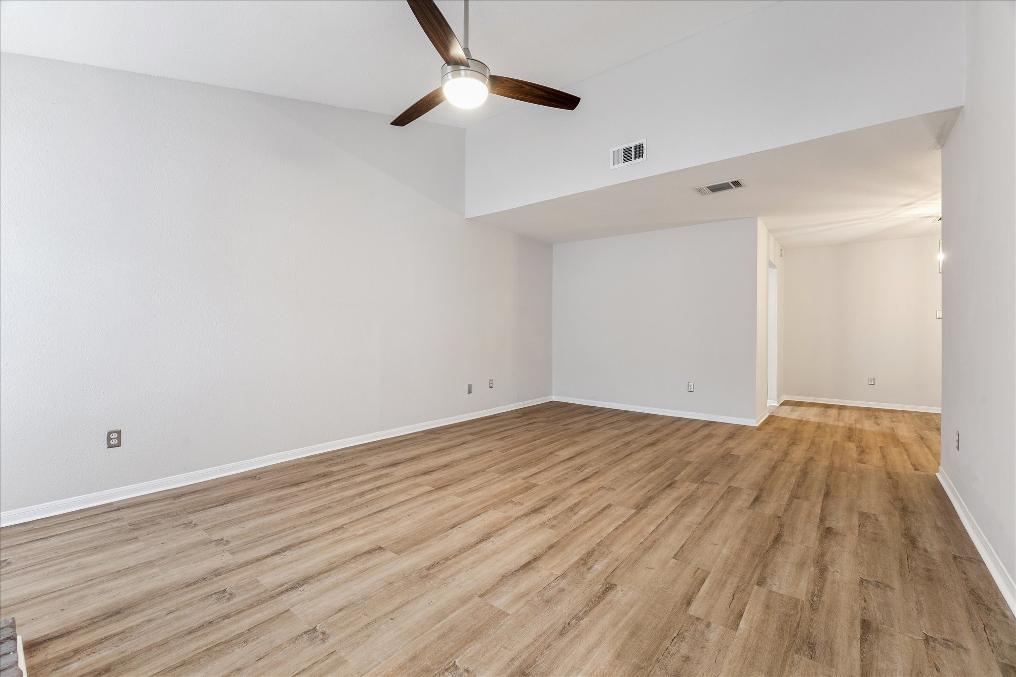 1201 Bering Drive, Unit 100 Houston, TX 77057 - Photo 5 of 20 a view of empty room with wooden floor