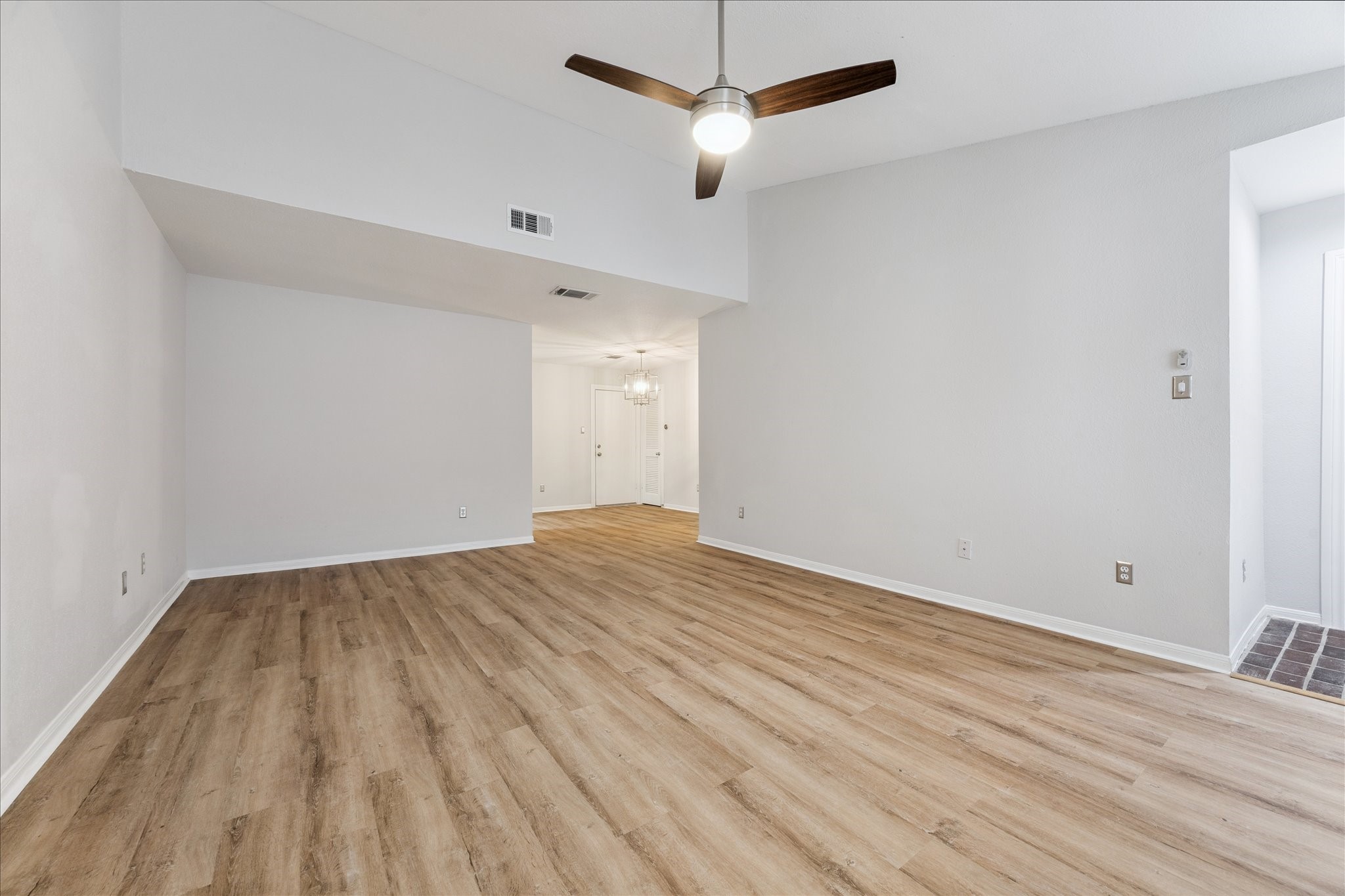 1201 Bering Drive, Unit 100 Houston, TX 77057 - Photo 7 of 20 a view of empty room with wooden floor