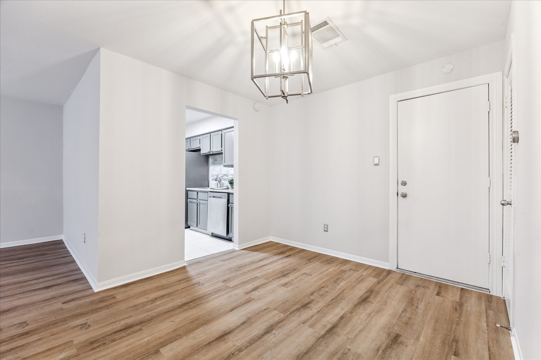 1201 Bering Drive, Unit 100 Houston, TX 77057 - Photo 8 of 20 a view of empty room with wooden floor