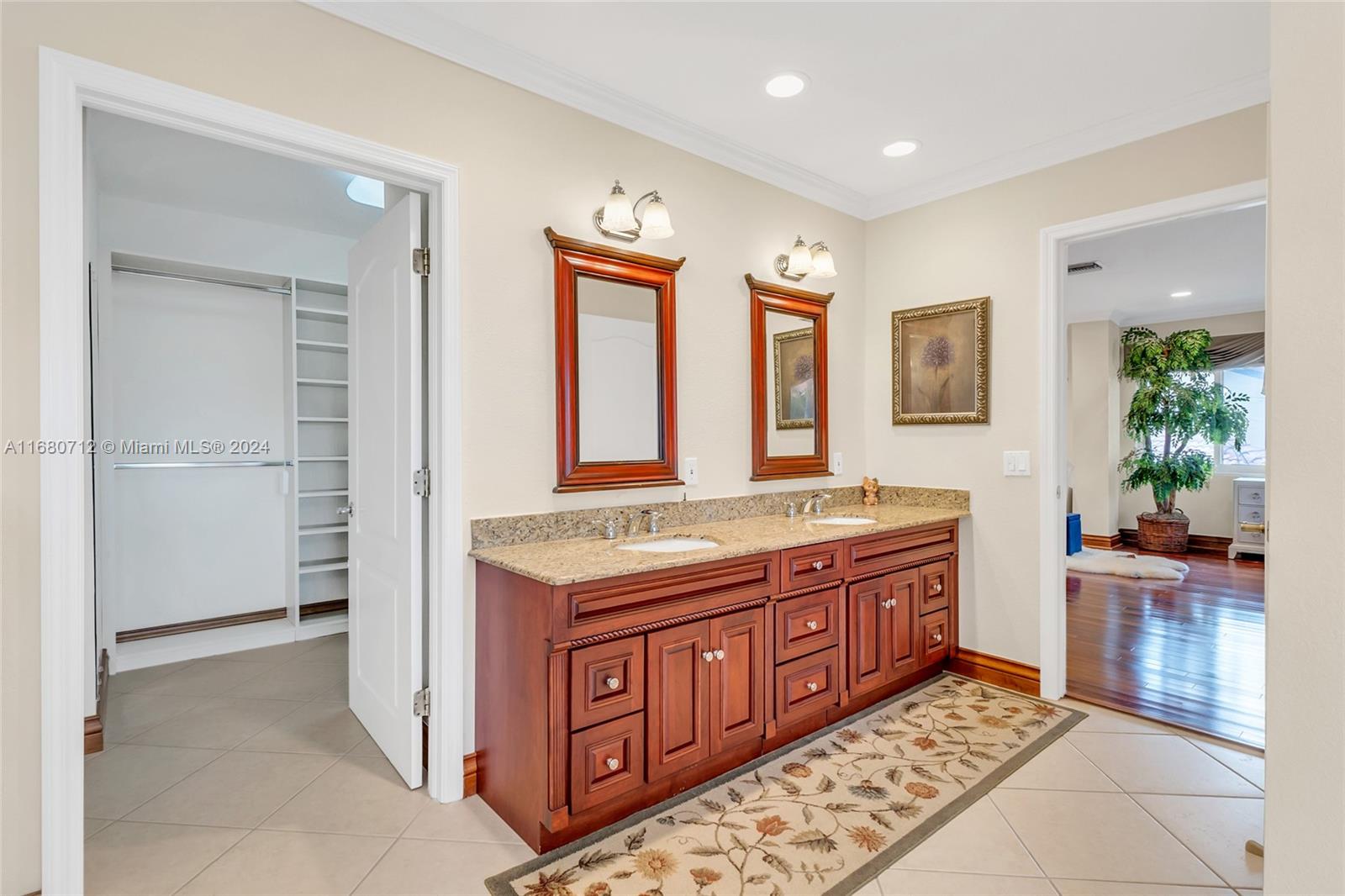 11451 Southwest 103rd Street Miami, FL 33176 - Photo 20 of 23 a bathroom with a granite countertop sink a mirror and a