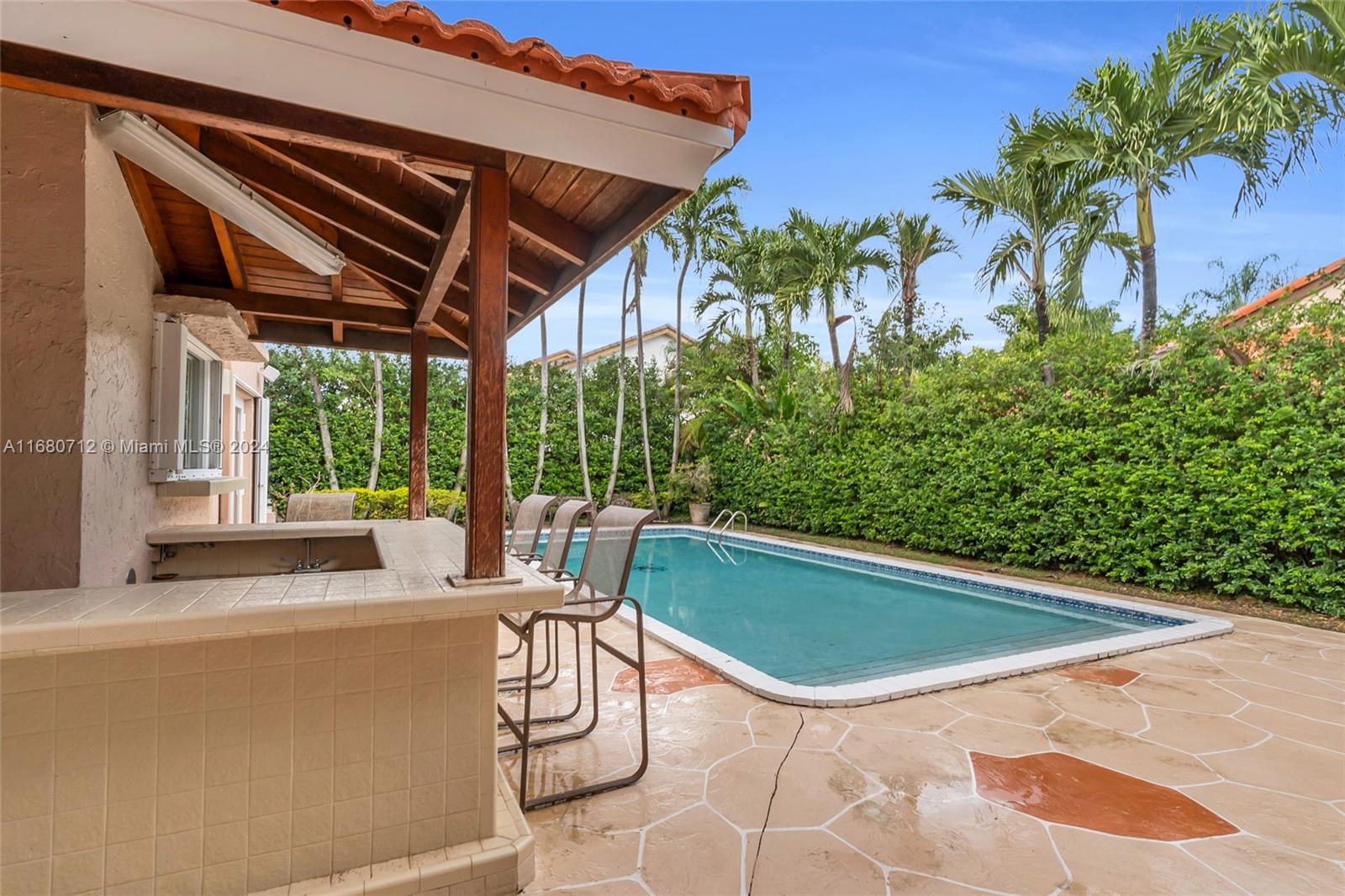 11451 Southwest 103rd Street Miami, FL 33176 - Photo 22 of 23 a view of a chairs and table in the patio
