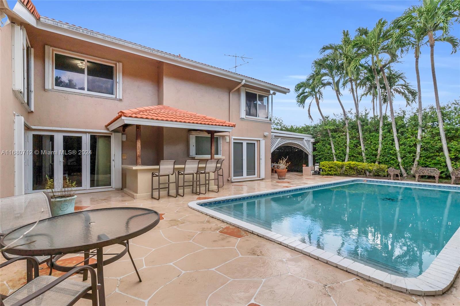 11451 Southwest 103rd Street Miami, FL 33176 - Photo 23 of 23 a front view of house with yard having outdoor seating