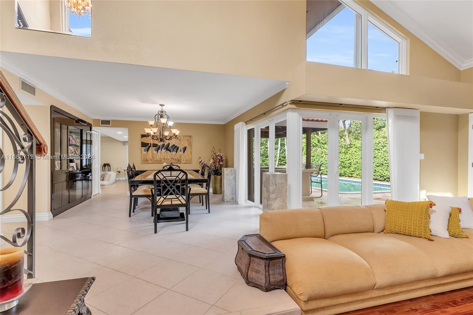 11451 Southwest 103rd Street Miami, FL 33176 - Photo 3 of 23 a living room with furniture and a large window