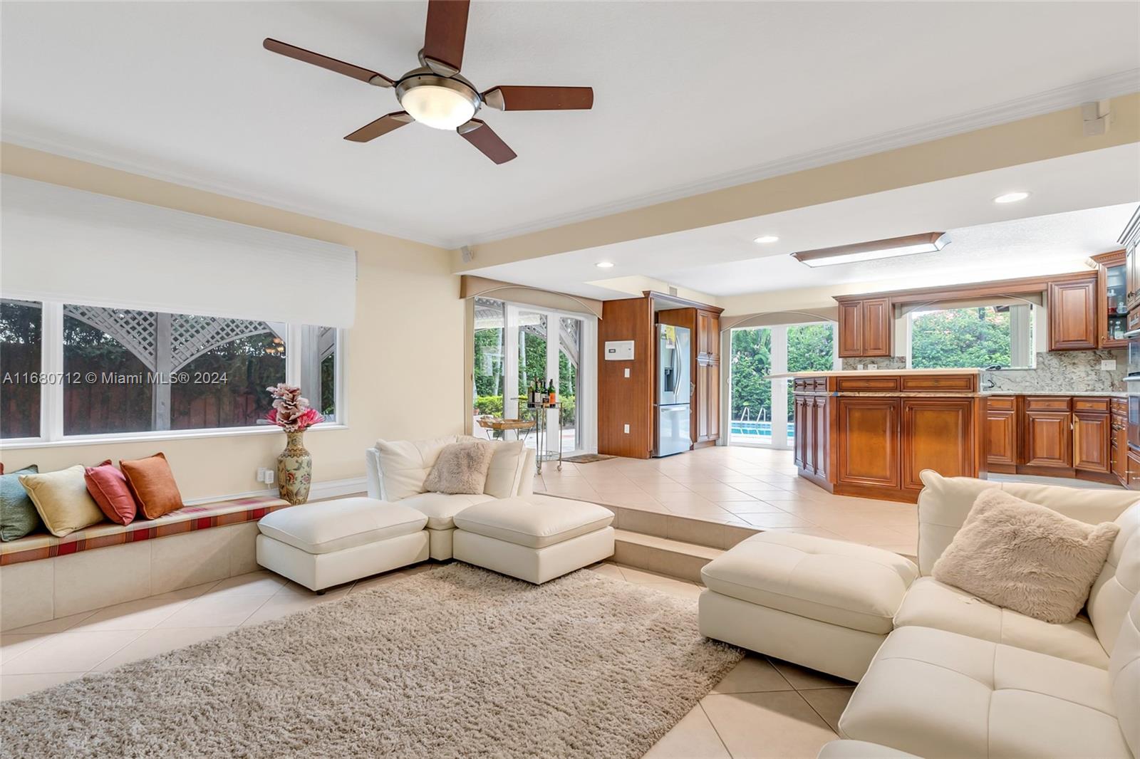 11451 Southwest 103rd Street Miami, FL 33176 - Photo 5 of 23 a living room with furniture and a large window