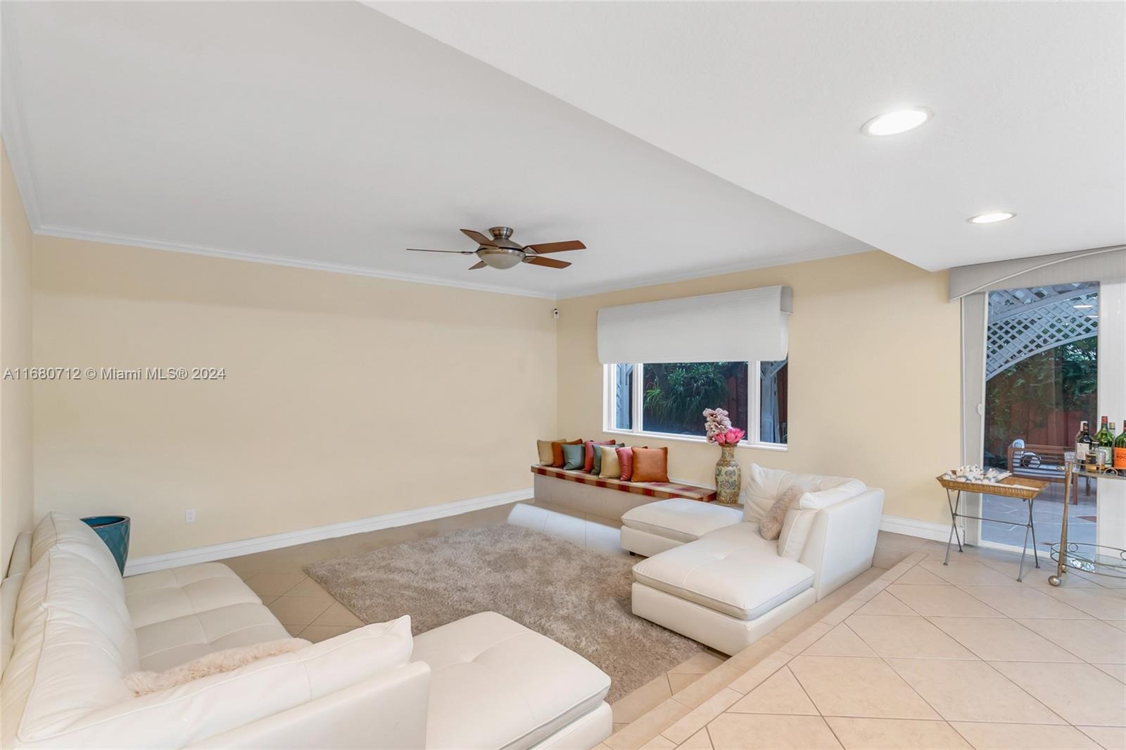 11451 Southwest 103rd Street Miami, FL 33176 - Photo 8 of 23 a living room with furniture and a flat screen tv