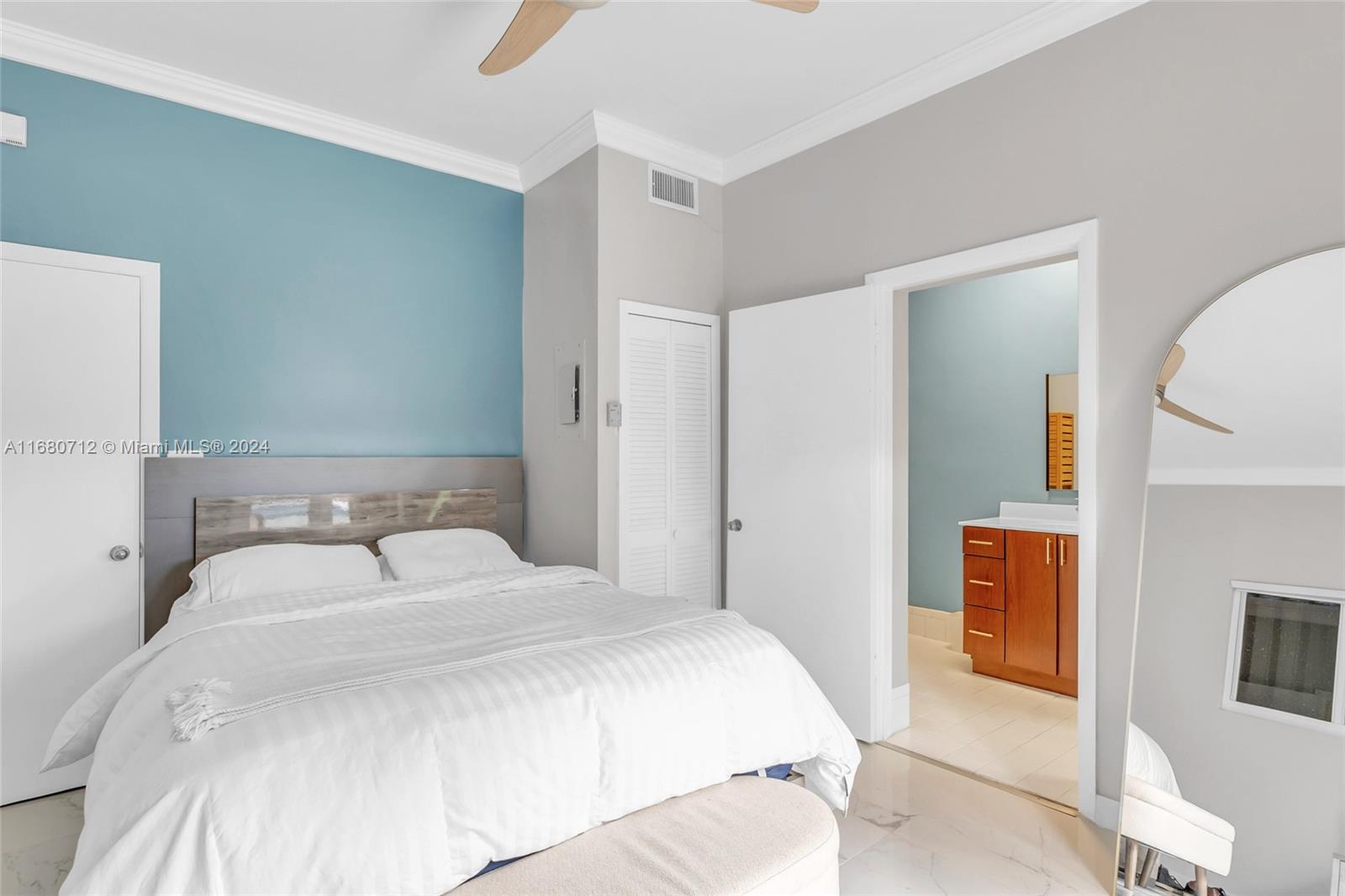 11451 Southwest 103rd Street Miami, FL 33176 - Photo 10 of 23 a bedroom with a bed and walk in closet