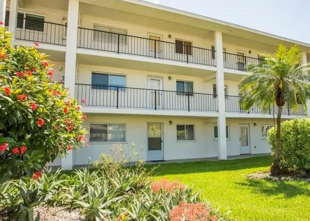 a view of a swimming pool with an outdoor space and seating area