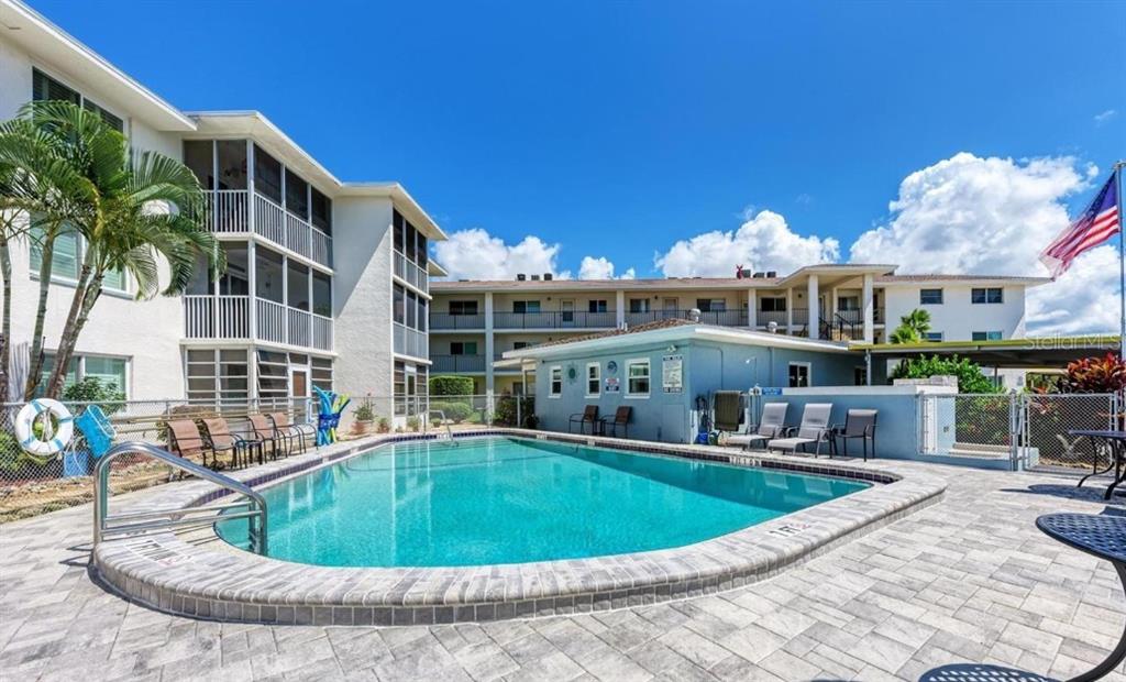 708 South Tamiami Trail, Unit 318 Venice, FL 34285 - Photo 12 of 13 a view of a house with a swimming pool