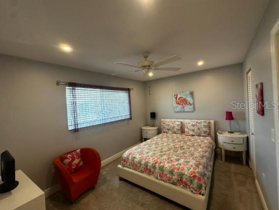 708 South Tamiami Trail, Unit 318 Venice, FL 34285 - Photo 7 of 13 a bedroom with a bed and a couch