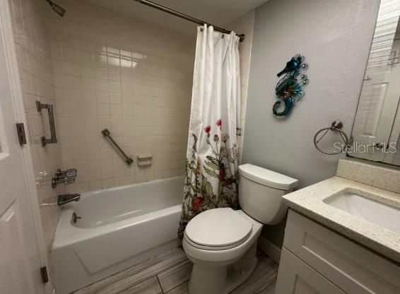 708 South Tamiami Trail, Unit 318 Venice, FL 34285 - Photo 10 of 13 a white toilet sitting next to a bath tub